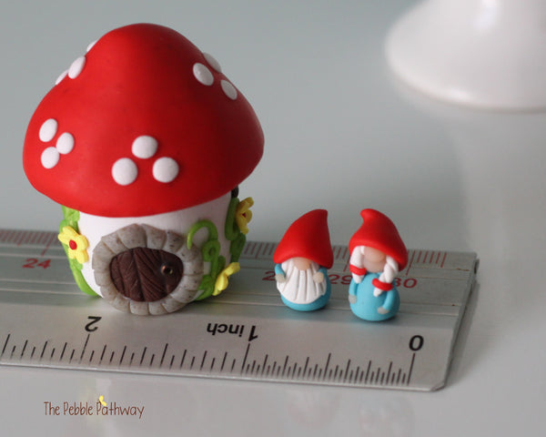 Tiny red mushroom with yellow flowers gnome home with removable top and gnomes inside