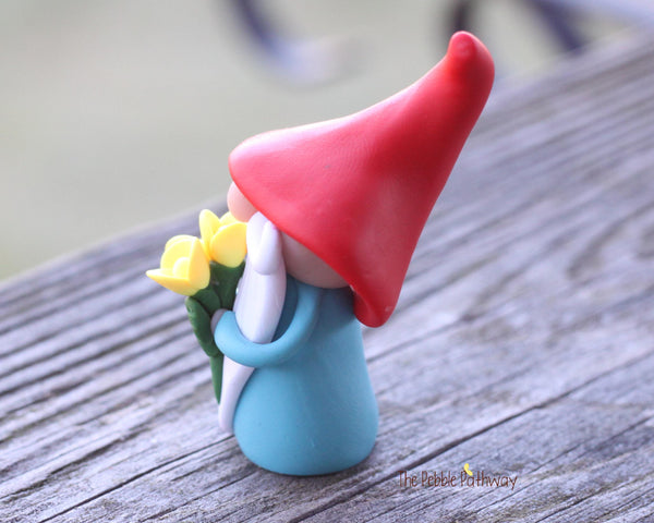 Gnome with bouquet of yellow flowers - miniature garden gnome figure