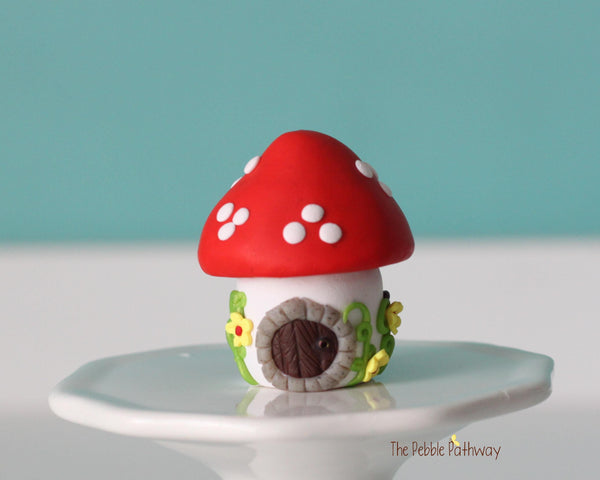 Tiny red mushroom with yellow flowers gnome home with removable top and gnomes inside