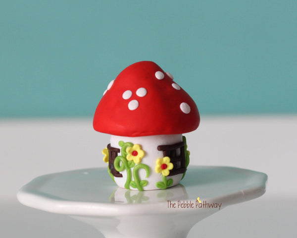 Tiny red mushroom with yellow flowers gnome home with removable top and gnomes inside